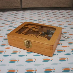 Large wooden hand crank music box with cute jungle animal cutout and transparent window design.