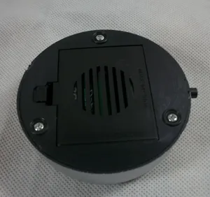 Detailed bottom view of round LED light base battery compartment for crystal display stands.
