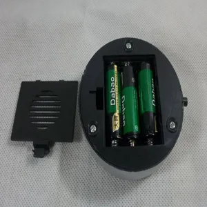Detail view of the LED base battery compartment showing internal structure and power setup.