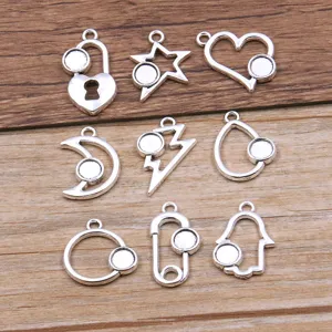 DIY alloy jewelry pendants set, 9 styles geometric charms for crafting and necklace making.