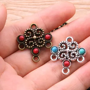 Close-up detail of vintage style alloy hollow multi-hole connector jewelry charms with resin.
