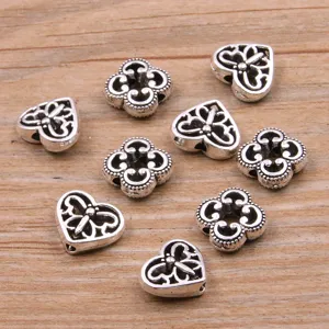 Perles en alliage de zinc DIY en gros, perles d'espacement cœur papillon et trèfle pour bijoux.