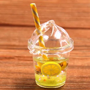 DIY resin miniature fruit cup charm pendant detail shot, cute drink model for phone case decor.