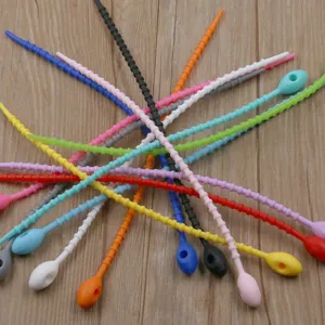 Silicone cable ties detail showing multi-color flexible reusable cord organizers and ties.