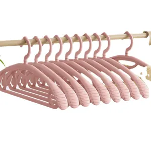 Pink plastic clothes hangers set, seamless wide shoulder design for home daily use and drying.