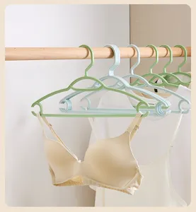 Plastic clothes hangers non-slip seamless garment racks for home dormitory closet storage.