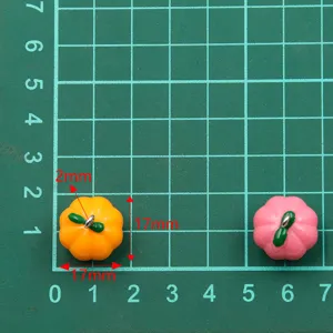 Close-up detail of resin pumpkin charm pendant with 17mm size for DIY jewelry making.