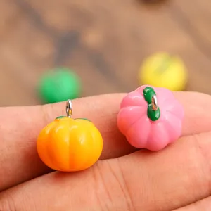 Colorful resin pumpkin charms for DIY jewelry making, cute Halloween jewelry pendants.