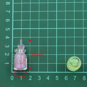 Colorful 15x34mm DIY resin bottle charm with cute expression and heart straw for crafts.