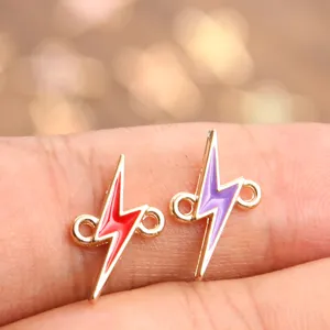 Close-up detail of colorful enamel lightning bolt charms with double loops for DIY jewelry.