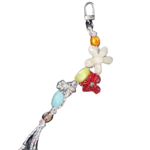 Handmade beaded phone charm bag pendant with colorful elements and flower design.