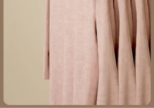 Pink textured fabric detail close-up showing soft vertical folds and elegant aesthetic appeal.