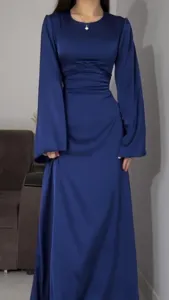 Detailed view of the dark blue satin maxi dress, highlighting the ruched waist design.