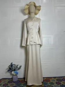Elegant vintage solid color long sleeve top and long skirt set for women, comfortable spring wear.