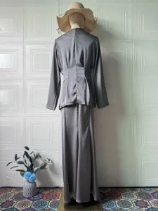 Elegant women's solid color long sleeve top and long skirt set, comfortable spring style.