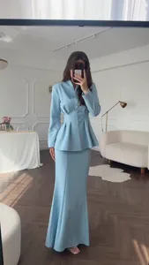 Elegant solid color long sleeve top and long mermaid skirt set for women, spring retro style.