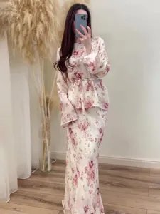 Floral two-piece long sleeve top and maxi skirt set with vintage pink print for summer fashion.