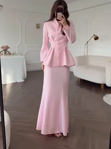 Elegant pink two piece skirt set with long sleeve peplum jacket and maxi skirt for women.