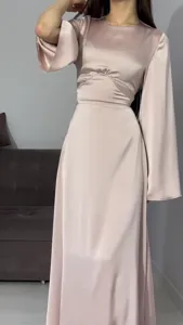 Detail view of the elegant satin maxi dress, showcasing waist cinching and draped sleeves.