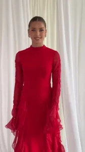 Close up view of red mock neck long sleeve ruffle dress elegant spring fashion item.