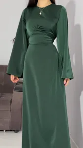 Elegant dark green satin maxi dress detail, featuring long sleeves and waist lace-up.