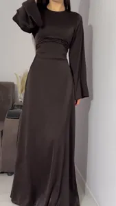 Elegant long sleeve satin maxi dress with waist cinching design for women spring wear.