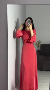 Elegant solid color long sleeve maxi dress with waist cinching design for women spring wear.