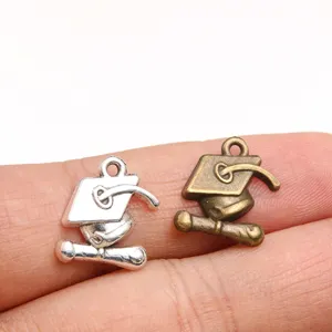 Silver and bronze graduation cap charms for DIY jewelry making, ideal for custom necklaces.