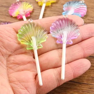 Resin acrylic shell lollipop pendant detail view, colorful DIY jewelry making accessory charm.