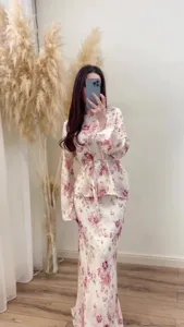 Elegant floral long sleeve top and matching skirt set, stylish vintage outfit for women.