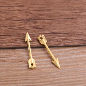 Detailed shot of miniature gold alloy arrow charm pendant, perfect for DIY jewelry making.