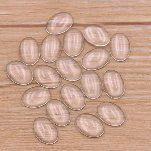 Mixed sizes oval clear glass cabochons blank time gems flat back top main view.