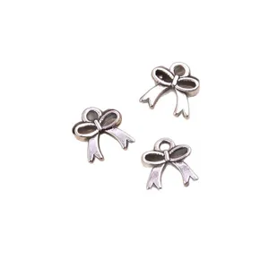DIY alloy bow charm pendants and connectors for bracelets, necklaces, and bags accessories.