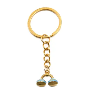 Stainless steel gold enamel dumbbell charm keychain detail view accessory pendant DIY jewelry.