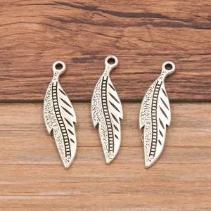 Silver leaf shape metal alloy pendant charms for DIY jewelry making and crafting details.