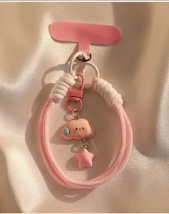 Closeup of pink cloud star charm, wrist strap keychain pendant, cute phone lanyard detail view.