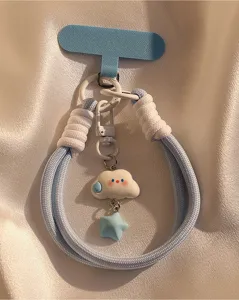 Cute blue woven phone lanyard with cloud and star charms, wrist strap keychain accessory detail.