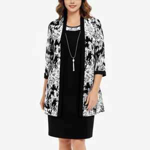 Detailed view of the elegant black white floral print cardigan and dress outfit.