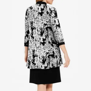 Two-piece set featuring a 3/4 sleeve patterned cardigan jacket and a solid black sleeveless dress.