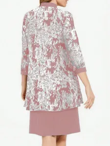 Detail view of a two-piece set featuring a floral three-quarter sleeve jacket and dress.