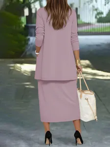 Detailed back view of a stylish pink-purple two-piece skirt set worn outdoors with tote bag.