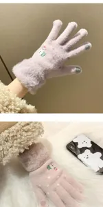 Close-up of winter touch screen gloves with cute snowman embroidery and plush cuff detail.