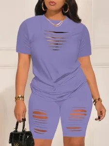 Purple cut-out t-shirt and shorts set detail, sexy summer outfit featuring trendy slashed design.