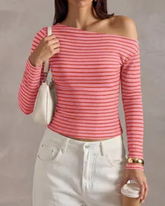 Detailed view of the trendy striped one shoulder long sleeve top in pink and red color.