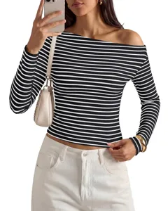 Detailed shot of a stylish black and white striped off-the-shoulder long sleeve top.