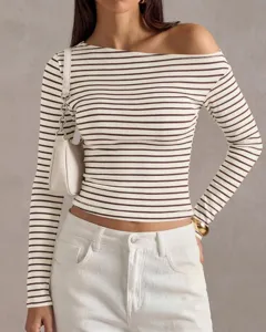 Close-up detail of women's brown and white striped off-the-shoulder long sleeve top.