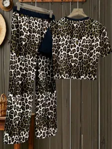 Detailed view of casual leopard print short sleeve top and straight pants outfit set.