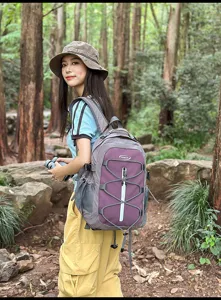 Outdoor casual backpack detail shot in forest, stylish color-blocking, lightweight travel bag.