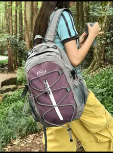 Outdoor travel backpack detail showing forest scene, stylish grey purple color contrast.
