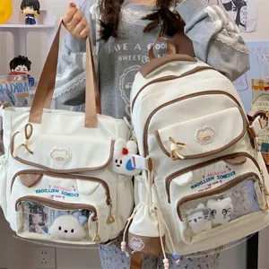 Canvas Ita Rucksack und Shopper Set mit Sichtfenster, süßen Plüschhängern und Farbdesign.
